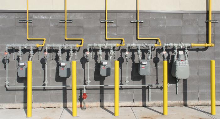 Row of gas meters outside a commercial building